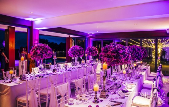 Elegant wedding reception with purple flowers decor