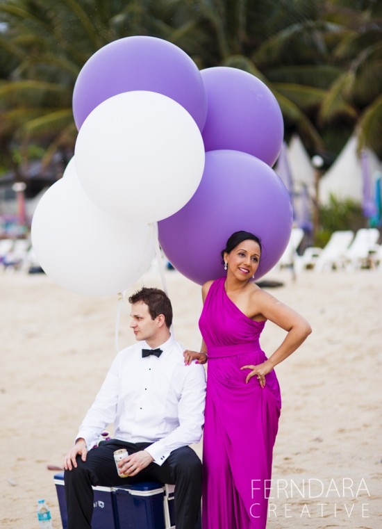 Beach wedding party balloons with woman in dress and man in tuxedo