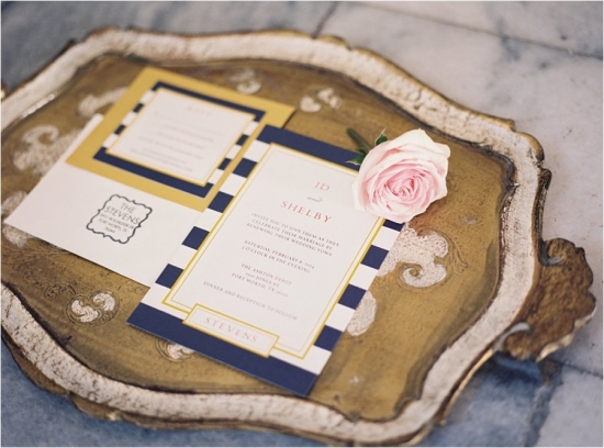 Elegant wedding invitation with a blush rose on a vintage tray