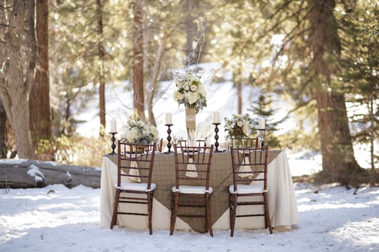 Winter wedding table setting in snowy forest