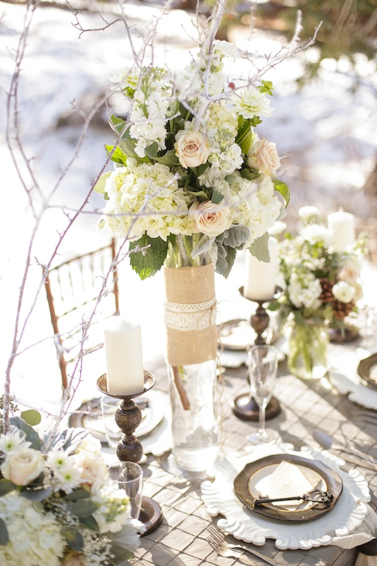Elegant winter wedding table setting with floral centerpiece