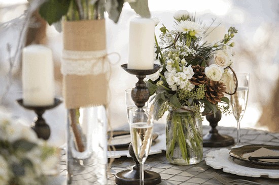 Elegant table setting with flowers candles and champagne glasses