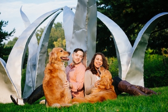 Couple with golden retrievers enjoying a beautiful day outdoors
