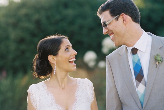 Happy bride and groom looking at each other