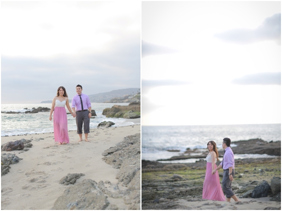 Couple walking hand in hand on a beach, joyful romantic pre-wedding photo