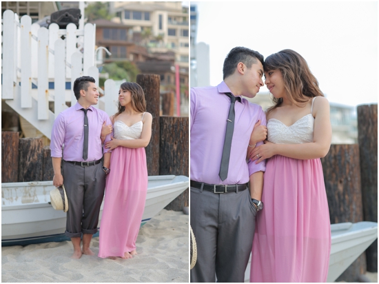 Romantic couple embracing each other at beach engagement photoshoot