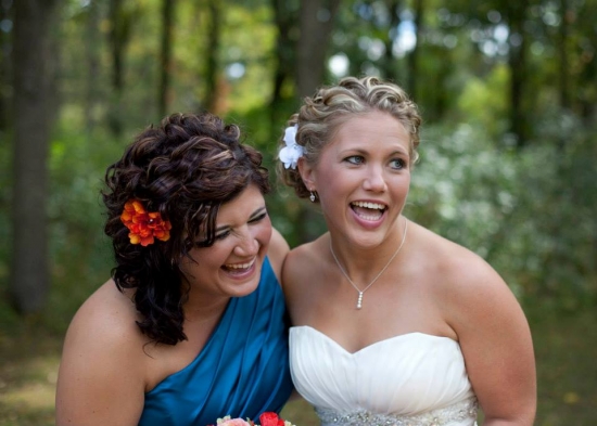 Happy bridesmaids laughing together at wedding