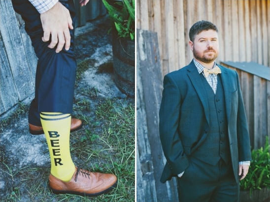 Groom in suit and fun beer socks, ready for a celebration