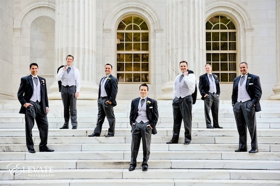 Groomsmen in formalwear on steps
