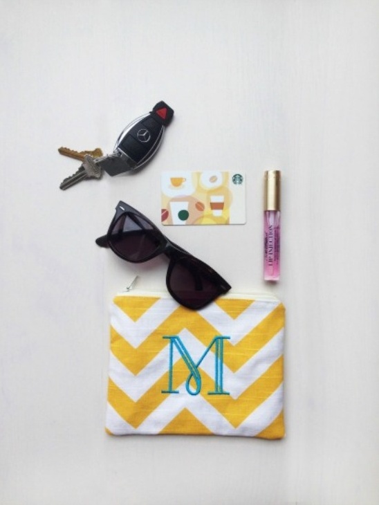 Yellow chevron pouch with monogram M, keys, sunglasses and Starbucks card