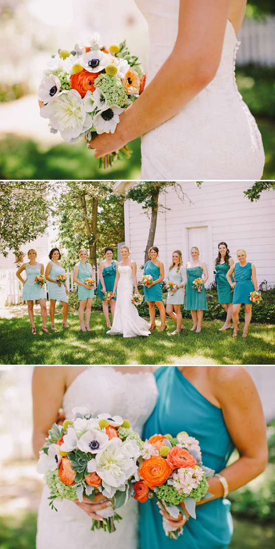 orange and white bouquets with verying teal bridesmaid dresses