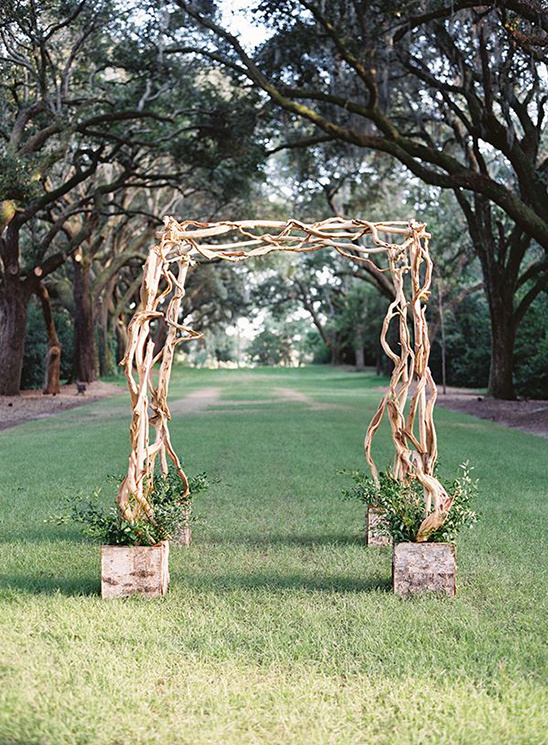 simple twisted wood wedding arch