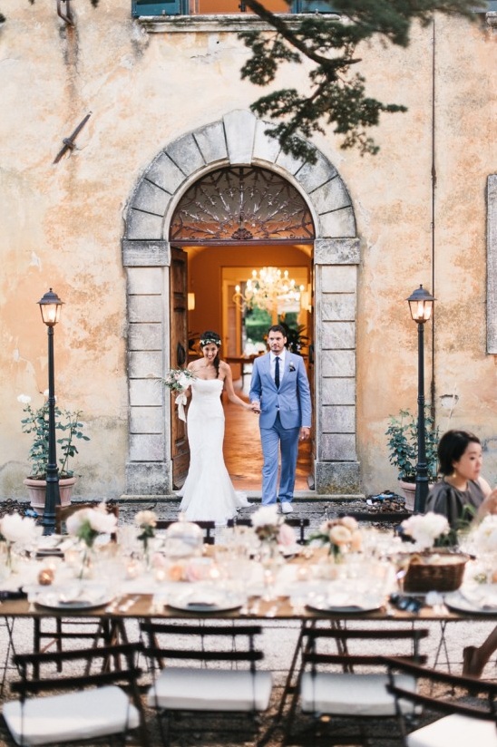 Couple leaving ceremony, wedding reception awaits