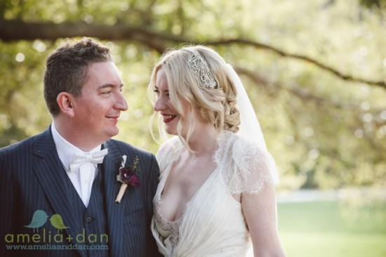 Happy bride and groom smiling outdoors on their wedding day