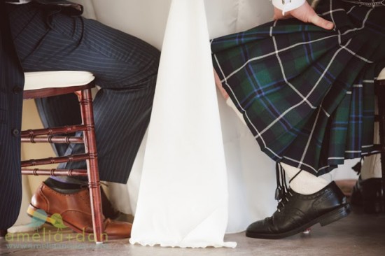 Man in suit and kilt at wedding