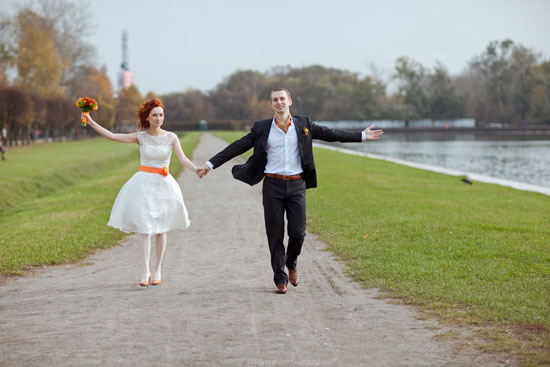 Happy bride and groom joyfully walking