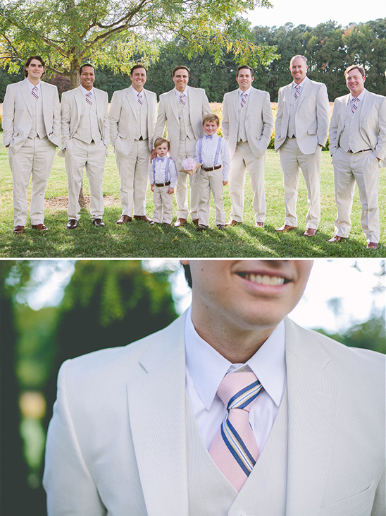 beige suit with pink and navy tie for the groom and his men