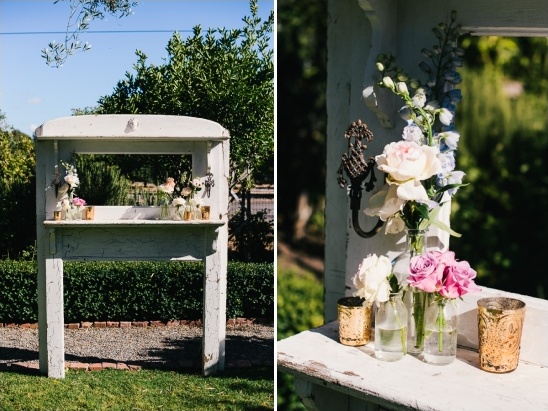 Rustic white frame decorated with flowers outdoors