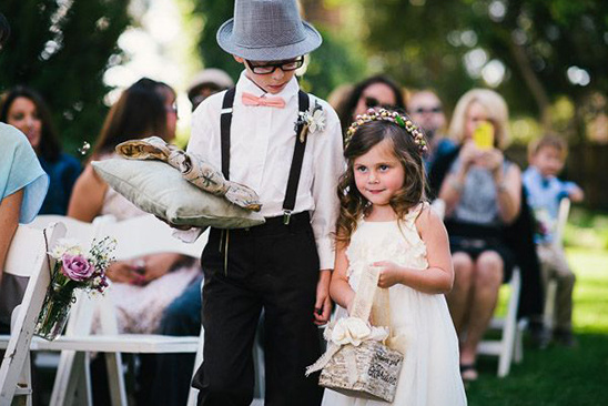 Ring bearer and flower girl at outdoor wedding