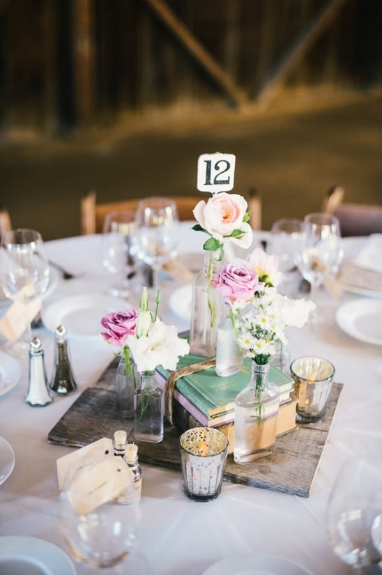 floral pieces and book combination for centerpieces