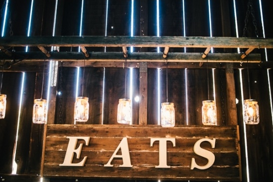 Rustic wooden sign saying eats