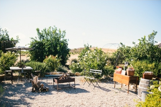 Outdoor patio setting with fire pit and tables