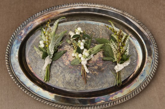 Elegant floral boutonnieres on antique tray
