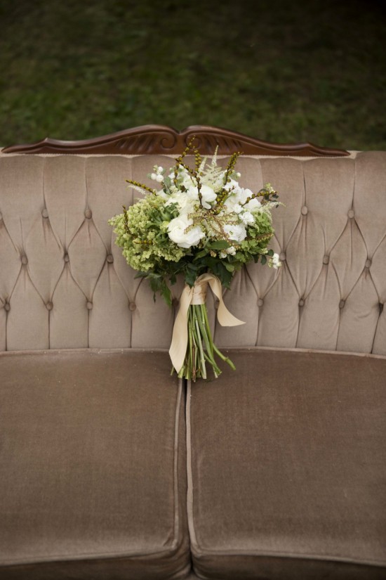 Elegant wedding bouquet on vintage couch