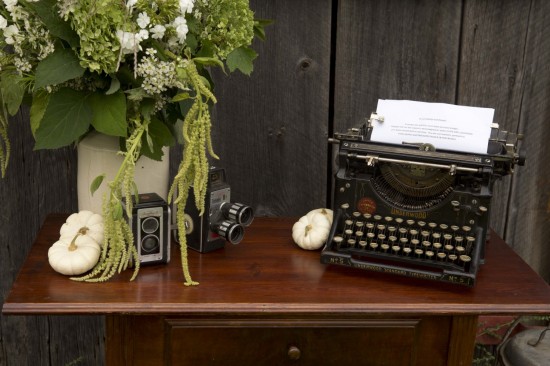 Vintage typewriter flowers and cameras