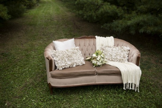 Rustic blush sofa outdoors with pillows