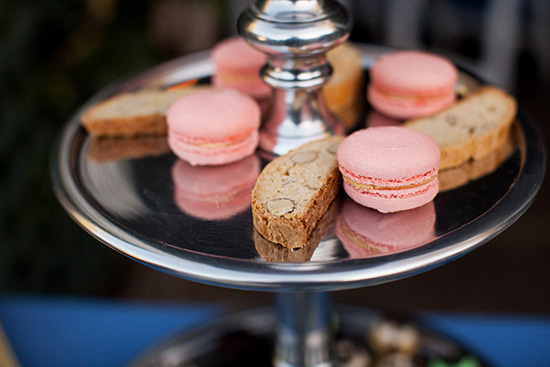 Pink macarons and biscotti on silver tray