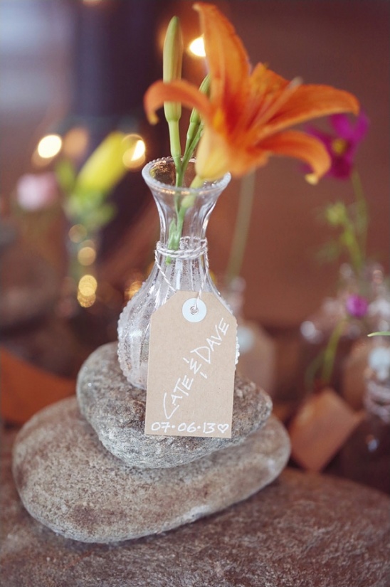 flowers and vase wedding favor doubles as an escort card