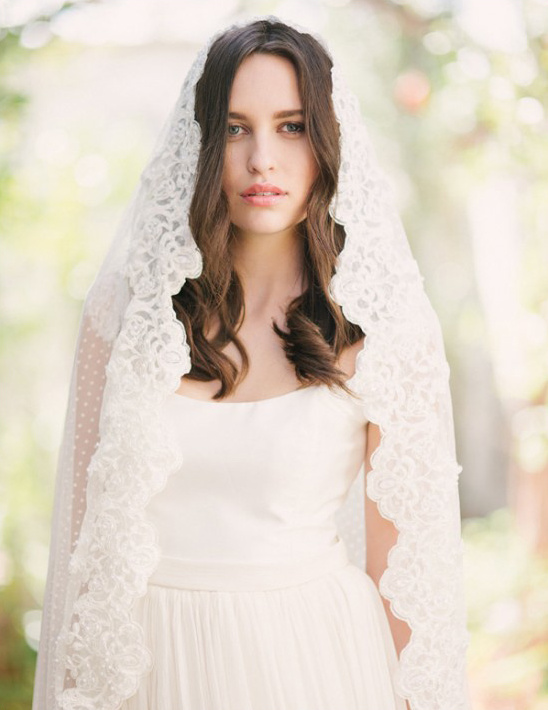 Bride in elegant lace wedding veil