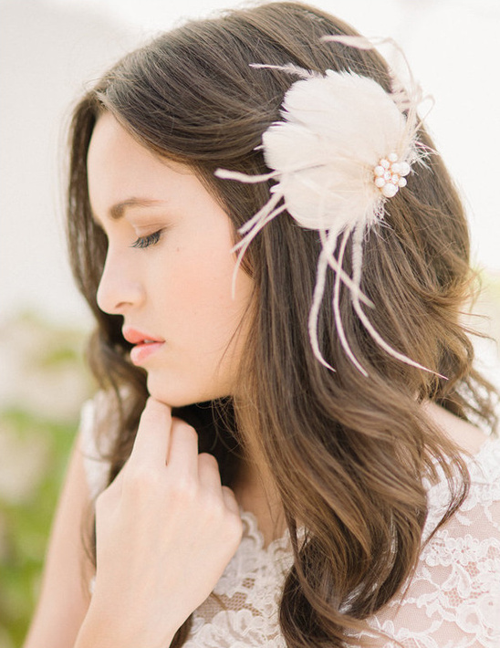 Bride with elegant feather hair accessory