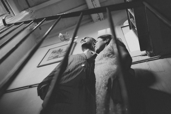 Elegant couple standing on a staircase