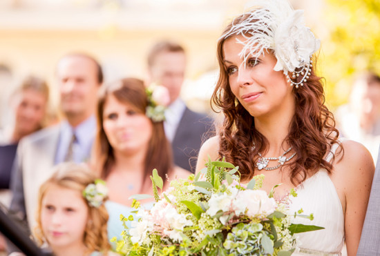 Beautiful bride with a bouquet at an outdoor wedding ceremony