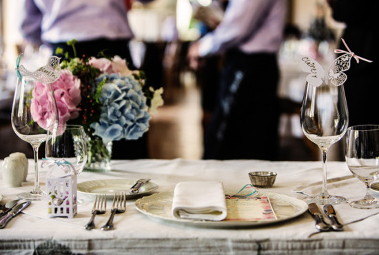 Elegant wedding table setting with floral centerpiece and name cards