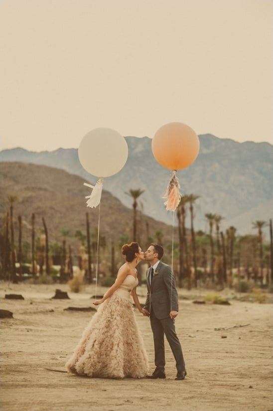 giant balloons and a wedding kiss captured by Yuna Leonard