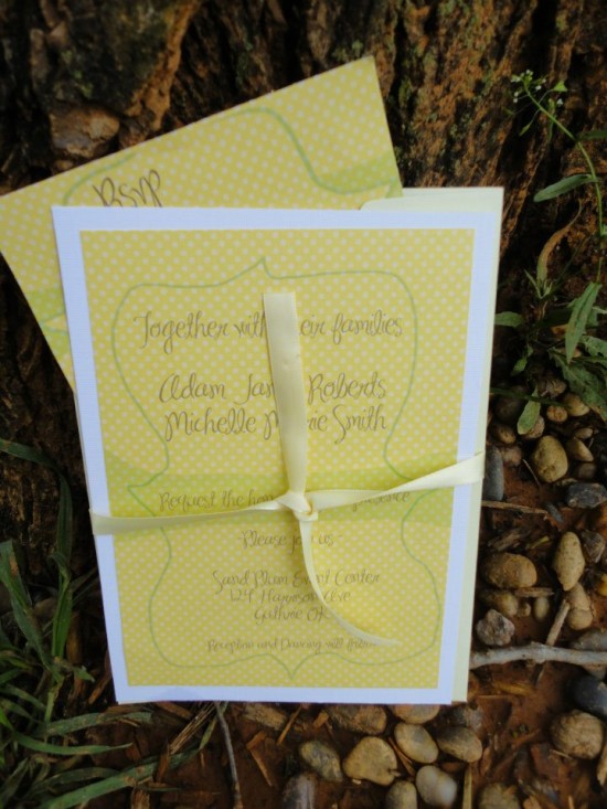 Cheerful yellow dotted wedding invite with cream ribbon