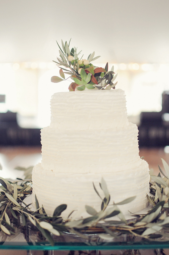 white wedding cake with olive branches