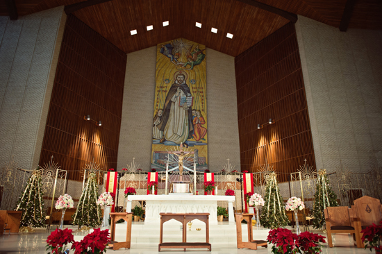 Church altar decorated for Christmas with religious art