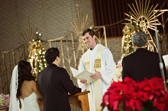 Wedding ceremony with priest officiating the marriage