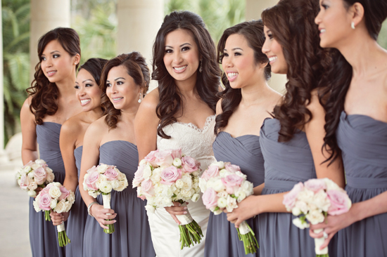 Bride and bridesmaids in grey dresses with pink bouquets