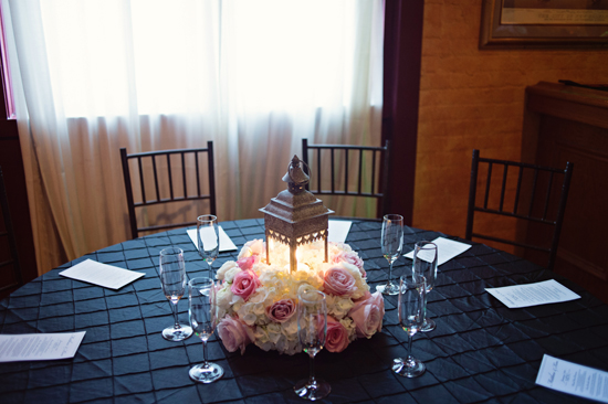 Elegant wedding table with lantern flowers and champagne