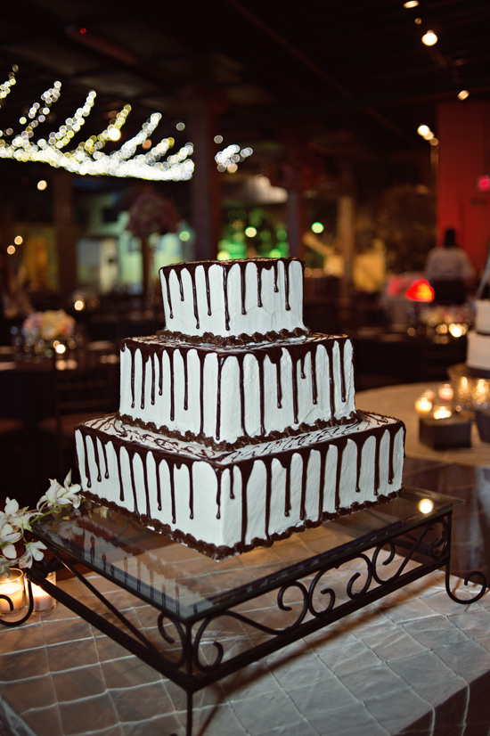 Three tier square wedding cake with chocolate drip