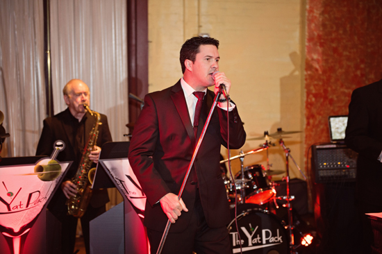 Live band The Yat Pack performing on stage at event