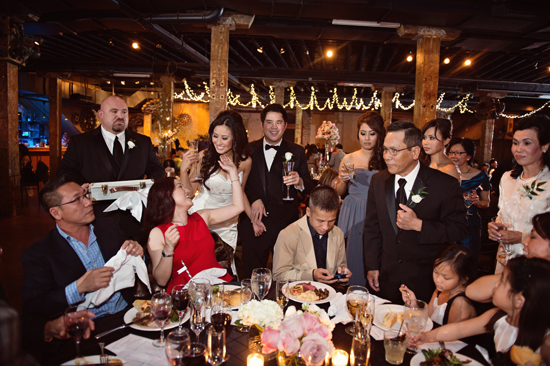 Joyful wedding reception with bride groom and guests
