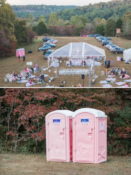 pink outhouses at outdoor wedding reception