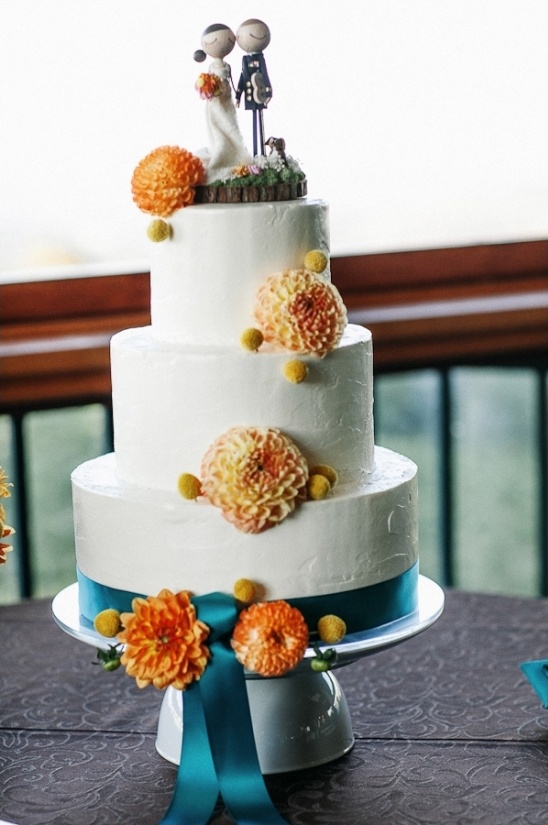 orange and teal wedding cake