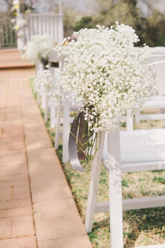 babys breath hanging from chairs